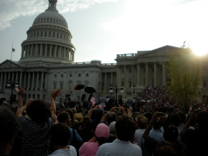 The crowd waves and applauds as Sen. Edward Kennedy's motorcade pulls up to the U.S. Capitol
